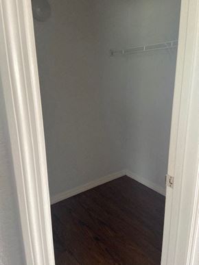 Orlando apartment for rent - a small room with a wooden floor and a white closet