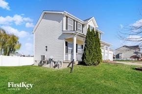 O'fallon house for rent - a white house with a lawn in front of it