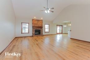 Camby house for rent - the living room with wood floors and a fireplace