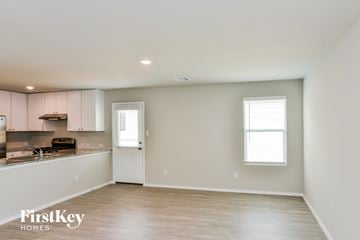 San Antonio house for rent - A spacious room with a kitchen area and a window.