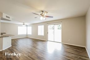 Glendale house for rent - an empty living room with wood flooring and a ceiling fan