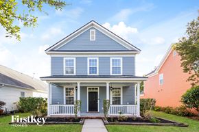 Summerville house for rent - a blue house with a sidewalk in front of it