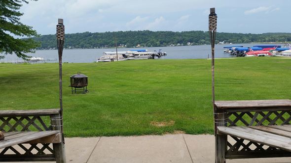 Lodi apartment for rent - a view of the lake from a patio with benches