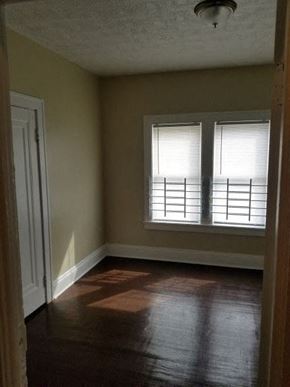 Cleveland apartment for rent - an empty room with a window and a door