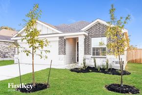 San Antonio house for rent - A house with a white front yard and a tree in the front.