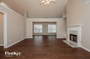 Union City house for rent - the living room with fireplace and wood flooring