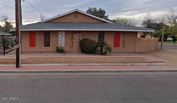Phoenix apartment for rent - a house with red curtains on the door on a street