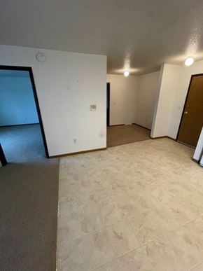 Fargo apartment for rent - A room with a brown door and a white wall.