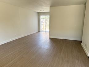 Anaheim apartment for rent - A room with wooden flooring and white walls.