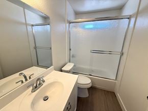 Anaheim apartment for rent - A white sink and toilet in a small bathroom.
