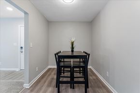 College Park apartment for rent - A dining room with a table and chairs.