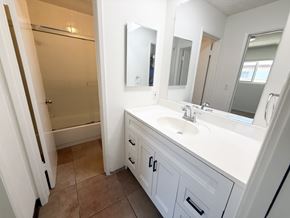 Garden Grove apartment for rent - A bathroom with a white sink and a white vanity.