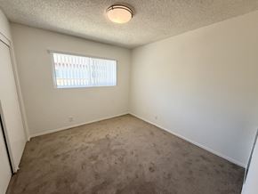 Garden Grove apartment for rent - A room with a window and carpeted floor.