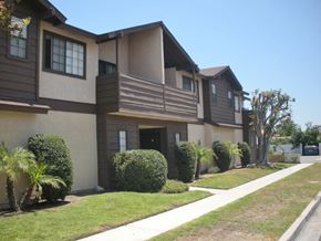 Garden Grove apartment for rent - A row of houses with a white pathway in front.