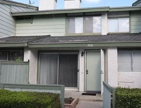 Ontario apartment for rent - a white house with a green door