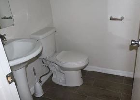 Ontario apartment for rent - a bathroom with a toilet and a sink