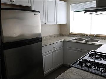 Ontario apartment for rent - a kitchen with a stove and a refrigerator