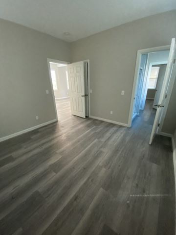 Colton apartment for rent - a living room with a wooden floor and a door