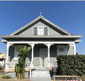 Colton apartment for rent - a house with a white porch and a statue on the front of it