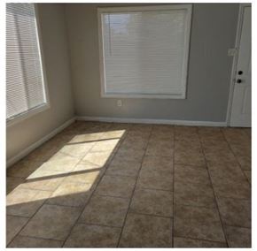 San Bernardino apartment for rent - a room with a tiled floor and two windows