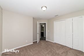 North Port house for rent - a bedroom with two closets and a door to a hallway