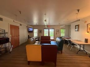 New Haven apartment for rent - A living room with a sofa, chairs, and a television.