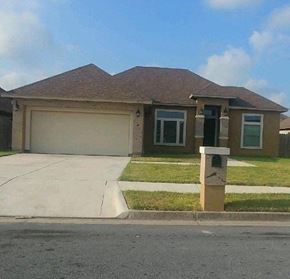 Brownsville house for rent - a house with a driveway and a parking meter