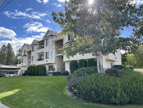 Spokane apartment for rent - a house with a lawn and a tree in front of it