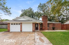 Baytown house for rent - a brick house with a white garage door