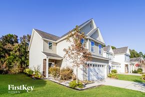 Ladson house for rent - a white house with a white garage door and a lawn