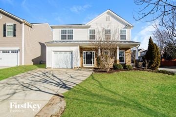 Holly Springs house for rent - a white house with a driveway and a lawn