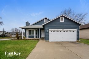 Lake St Louis house for rent - a blue house with a white garage door