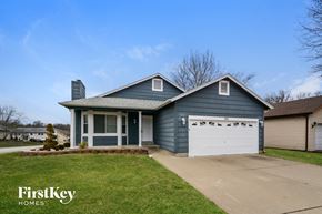 Lake St Louis house for rent - a blue house with a white garage door