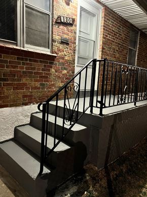 St. Louis apartment for rent - a pair of stairs in front of a brick building