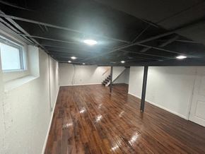 St. Louis apartment for rent - a living room with a wooden floor and white walls
