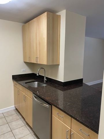 St. Louis apartment for rent - A kitchen with a sink and cabinets.