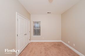 Trussville house for rent - a bedroom with carpet and a door to a closet