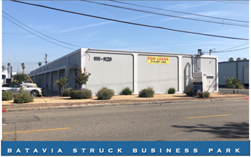 Orange apartment for rent - A building with a sign that says "For Lease" is located in Batavia Struck Business Park.