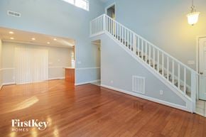 Winston Salem house for rent - the living room and dining room with the staircase to the second floor