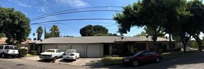 San Bernardino apartment for rent - a house with three cars parked in front of it