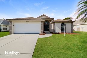 Ellenton house for rent - A house with a garage and a driveway is for sale.