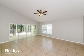 Ellenton house for rent - A spacious room with a ceiling fan and tiled floor.