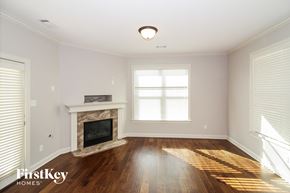 Arlington house for rent - a living room with a fireplace and wooden floors