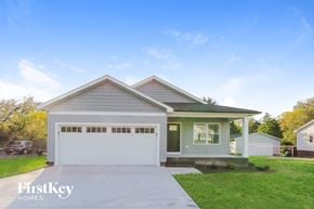 Kannapolis house for rent - a home with a driveway and a white garage door