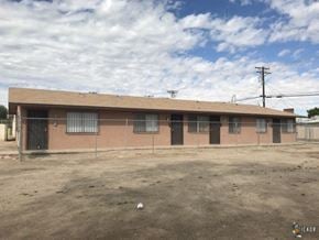 El Centro apartment for rent - a building with a chain link fence in front of it