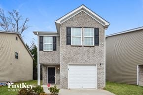 Conyers house for rent - A house with a garage door is for sale by FirstKey Homes.