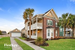 Moncks Corner house for rent - A house with a palm tree in front of it.