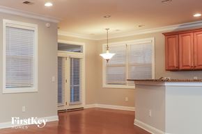 Moncks Corner house for rent - A kitchen with a brown floor and white walls.