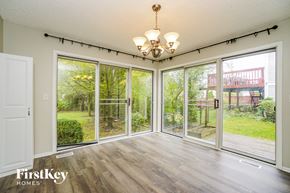 Hilliard house for rent - a living room with large windows and a chandelier