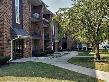 Burnham apartment for rent - a sidewalk in front of a brick apartment building
